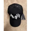 Amiri Staggered Logo Trucker Hat Black #A37246