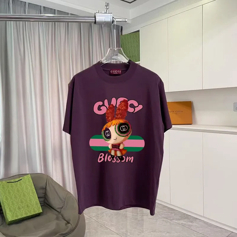 Gucci Purple T Shirt Featuring Blossom Cartoon Doll Graphic with Pink and Green Design Accents #A54263