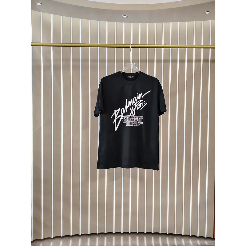 Balmain Paris Black/White T Shirt Featuring Stranger Things Logo and Bold Collaborative Graphic Design for Streetwear Fans #A54259