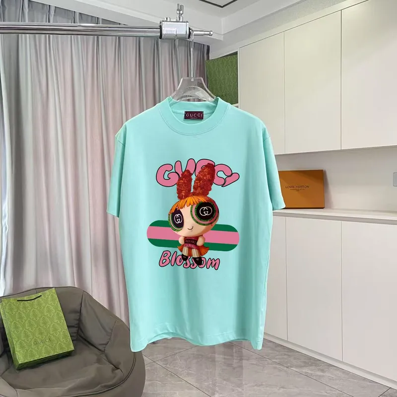 Gucci Purple T Shirt Featuring Blossom Cartoon Doll Graphic with Pink and Green Design Accents #A54263