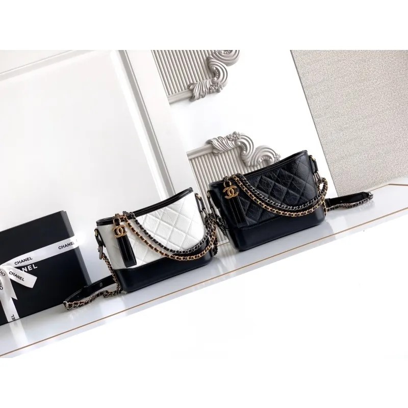 Chanel Womens Bucket Bag - Black & White Quilted Leather, Gold-Tone CC Logo & Two-Tone Chain Strap, Stylish Crossbody Bag for Luxury Fashion #A56750