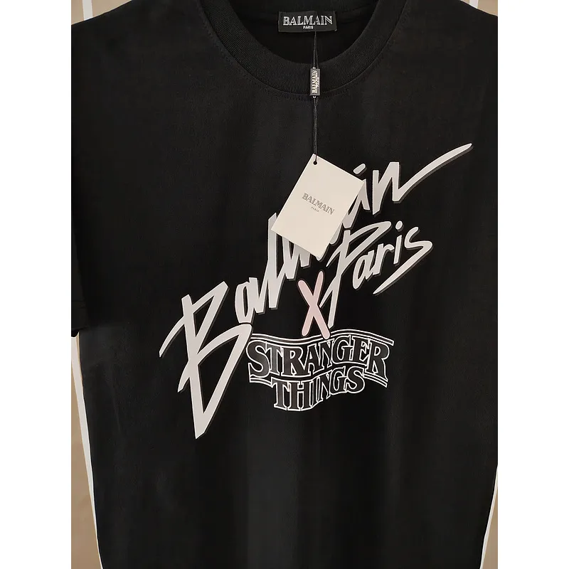 Balmain Paris Black/White T Shirt Featuring Stranger Things Logo and Bold Collaborative Graphic Design for Streetwear Fans #A54259