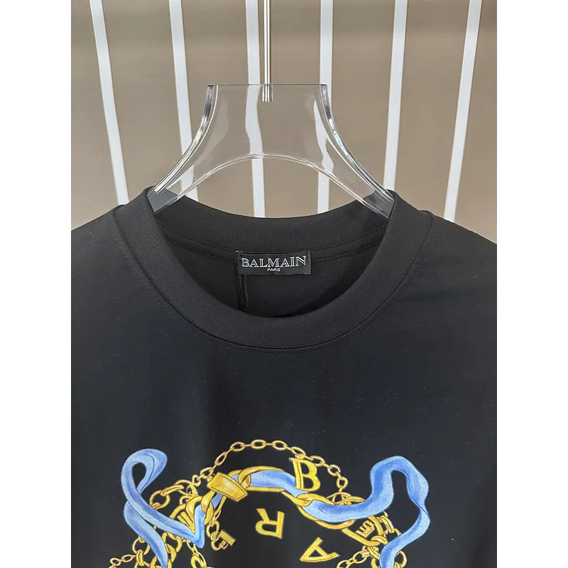 Balmain Paris White/Black T Shirt with Gold Chain and Blue Ribbon Circular Graphic Design for Men #A54257