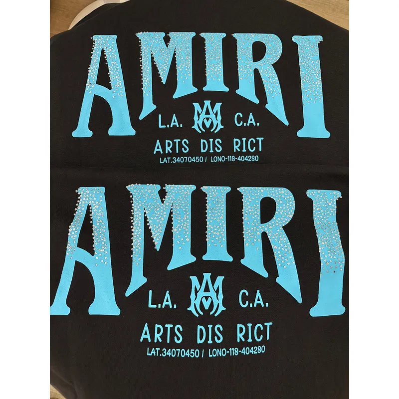 AMIRI Black Hoodie With Glittery Blue Back Logo And Brand Details #A54287 AMIRI Black Hoodie With Glittery Blue Back Logo And Brand Details #A54287