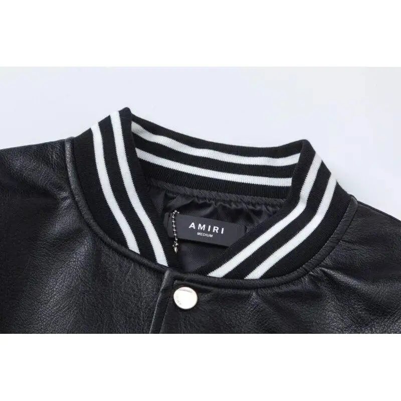 AMIRI Black Leather Bomber Jacket With Iconic Logo And Varsity Stripe Details #A54436 AMIRI Black Leather Bomber Jacket With Iconic Logo And Varsity Stripe Details #A54436