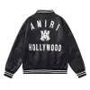 AMIRI Black Leather Bomber Jacket With Iconic Logo And Varsity Stripe Details #A54436 AMIRI Black Leather Bomber Jacket With Iconic Logo And Varsity Stripe Details #A54436