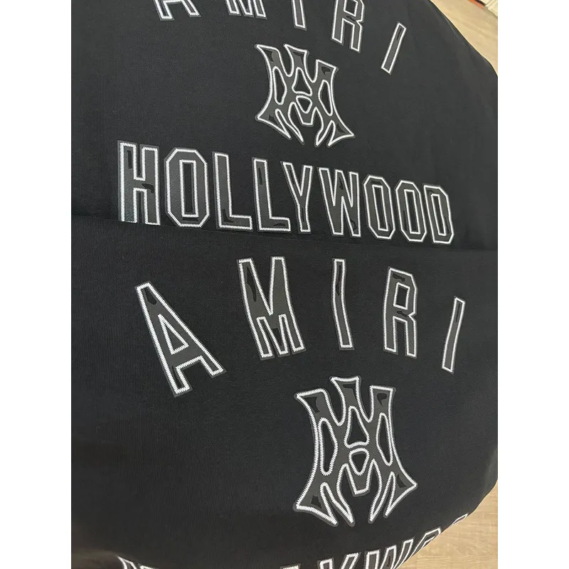 AMIRI Black Hoodie With Bold White Hollywood Logo And Ornate Emblem #A54289
