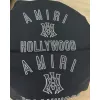 AMIRI Black Hoodie With Bold White Hollywood Logo And Ornate Emblem #A54289