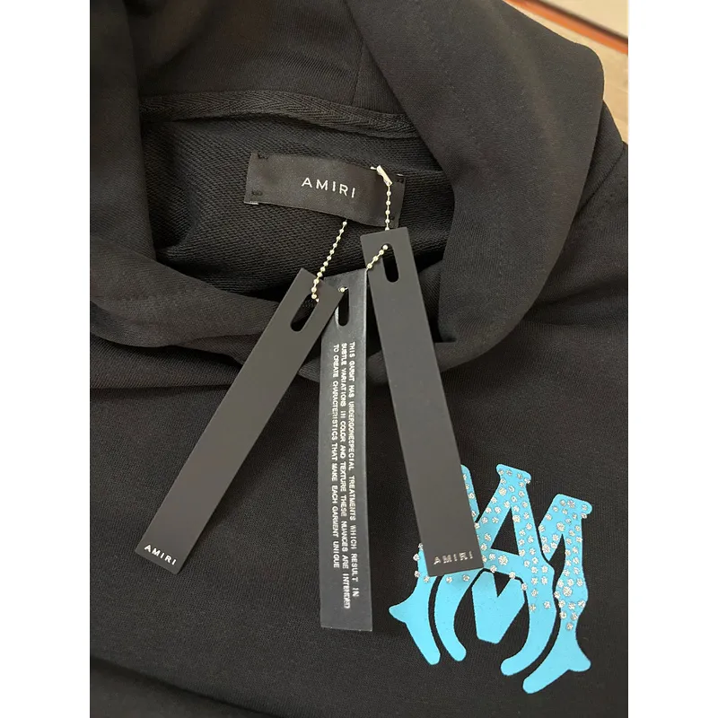 AMIRI Black Hoodie With Glittery Blue Back Logo And Brand Details #A54287 AMIRI Black Hoodie With Glittery Blue Back Logo And Brand Details #A54287