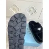 Prada Womens Shearling Lined Mule Slippers Triangle Logo Thick Sole Design for Cozy Luxury Winter Footwear #A57764