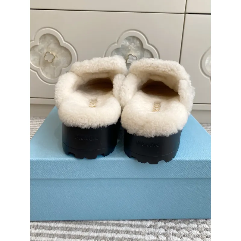 Prada Womens Shearling Lined Mule Slippers Triangle Logo Thick Sole Design for Cozy Luxury Winter Footwear #A57765