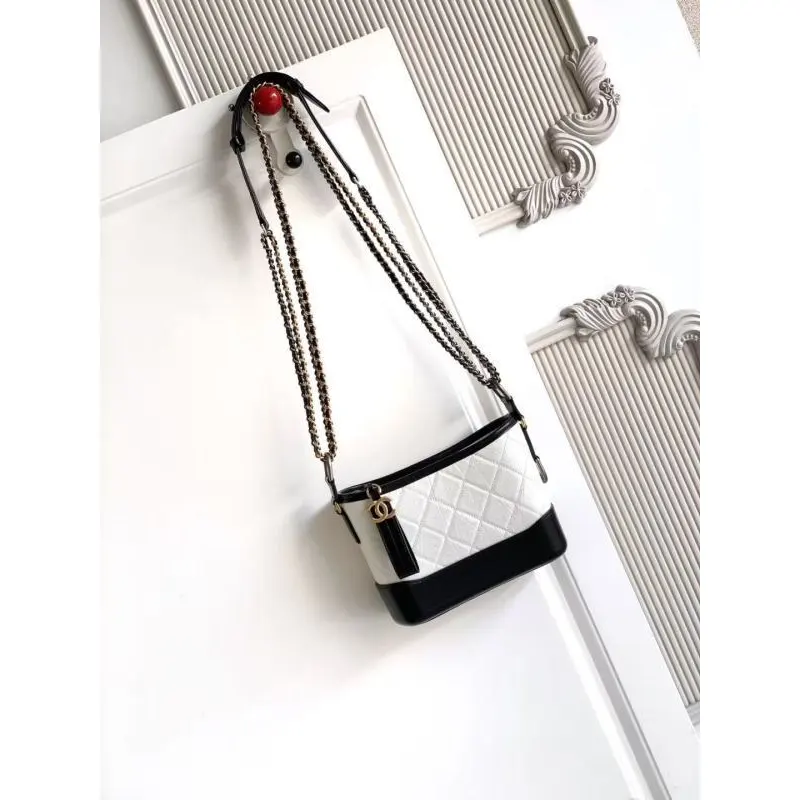 Chanel Womens Bucket Bag - Black & White Quilted Leather, Gold-Tone CC Logo & Two-Tone Chain Strap, Stylish Crossbody Bag for Luxury Fashion #A56750
