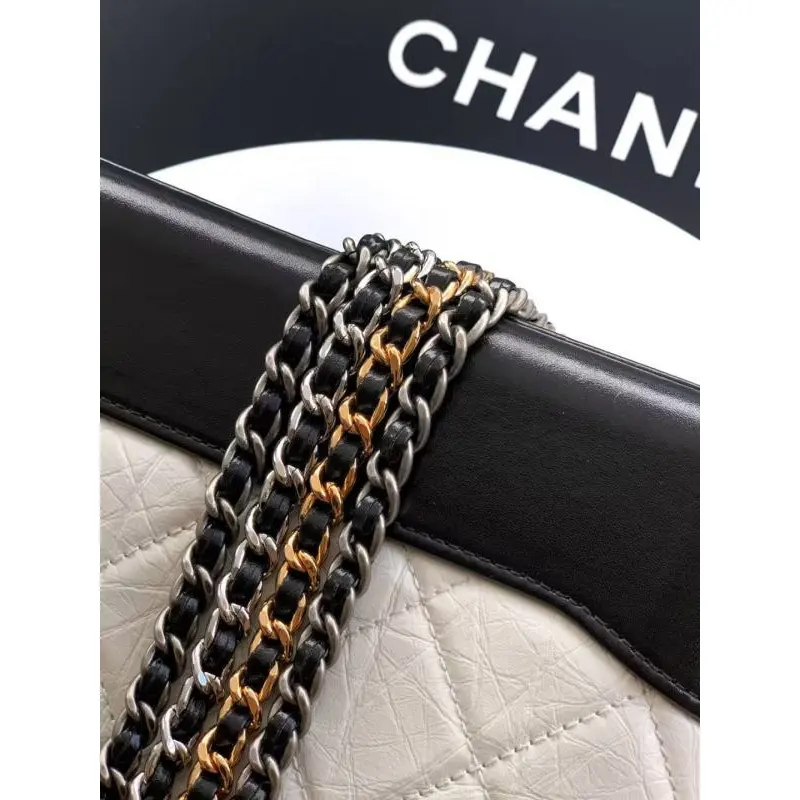 Chanel Womens Bucket Bag - Black & White Quilted Leather, Gold-Tone CC Logo & Two-Tone Chain Strap, Stylish Crossbody Bag for Luxury Fashion #A56750