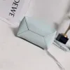 Loewe Womens Mini Bucket Bag - Light Blue Leather with Penguin Embroidery, Convertible Handle & Crossbody Strap, Playful Luxury Handbag with Anagram Logo #A56856