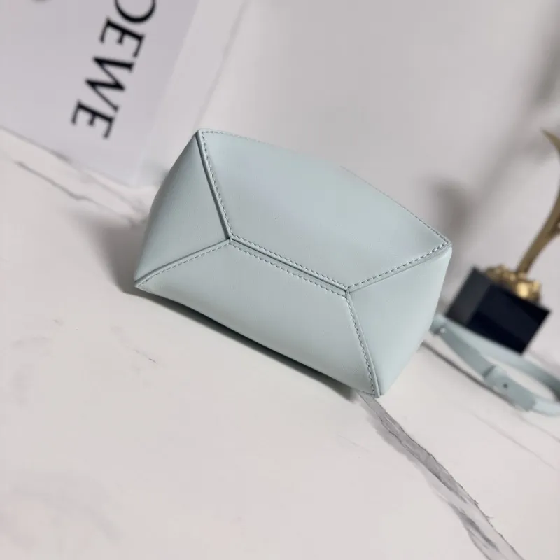 Loewe Womens Mini Bucket Bag - Light Blue Leather with Penguin Embroidery, Convertible Handle & Crossbody Strap, Playful Luxury Handbag with Anagram Logo #A56856