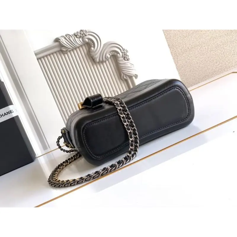 Chanel Womens Bucket Bag - Black & White Quilted Leather, Gold-Tone CC Logo & Two-Tone Chain Strap, Stylish Crossbody Bag for Luxury Fashion #A56750