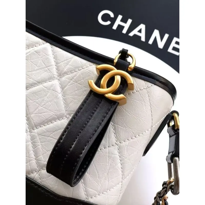 Chanel Womens Bucket Bag - Black & White Quilted Leather, Gold-Tone CC Logo & Two-Tone Chain Strap, Stylish Crossbody Bag for Luxury Fashion #A56750