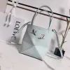 Loewe Womens Mini Bucket Bag - Light Blue Leather with Penguin Embroidery, Convertible Handle & Crossbody Strap, Playful Luxury Handbag with Anagram Logo #A56856