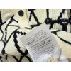valentino Womens V Neck Cardigan Sweaters Iconic V Logo Pattern in Dual Colors for Luxury Fashion Enthusiasts #A57753