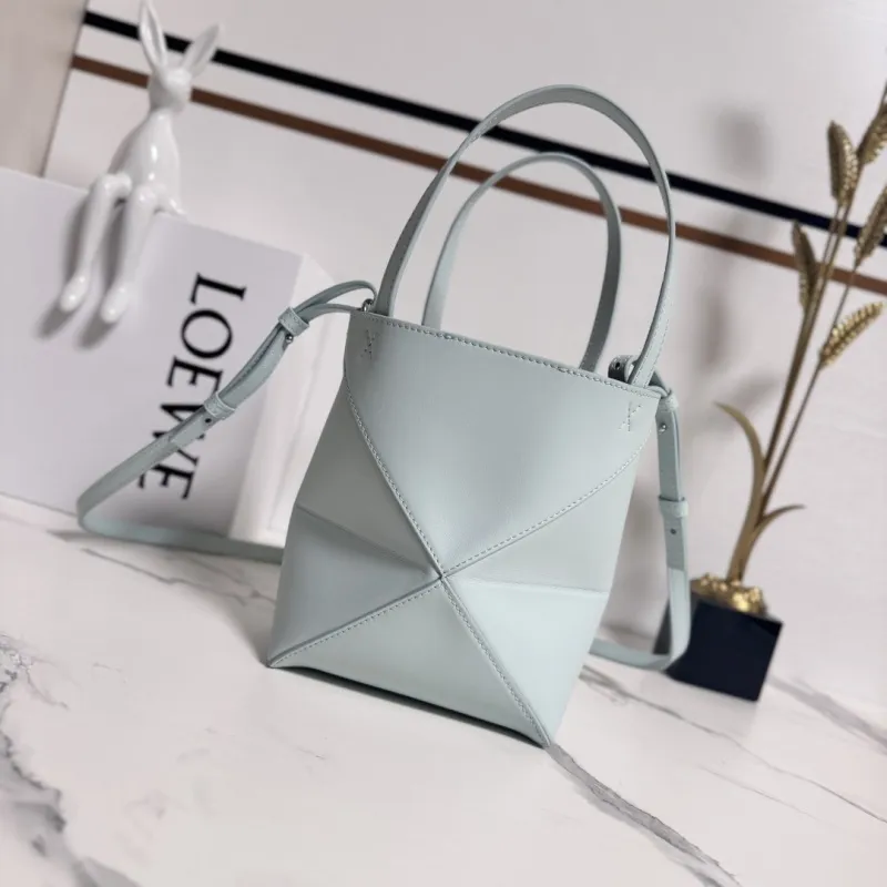 Loewe Womens Mini Bucket Bag - Light Blue Leather with Penguin Embroidery, Convertible Handle & Crossbody Strap, Playful Luxury Handbag with Anagram Logo #A56856