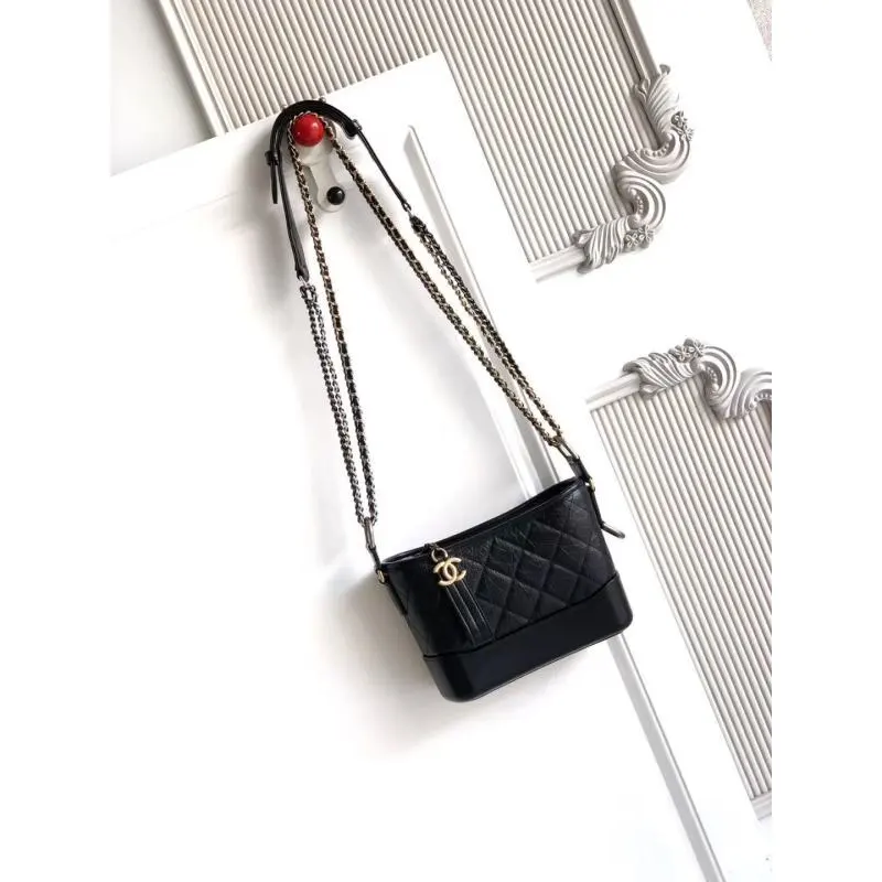 Chanel Womens Bucket Bag - Black & White Quilted Leather, Gold-Tone CC Logo & Two-Tone Chain Strap, Stylish Crossbody Bag for Luxury Fashion #A56750