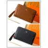 Hermès Leather Zip - Around Wristlet Clutches In Brown And Black With Branded Detailing #A50707