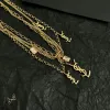 Saint Laurent Cassandre Multi Layer Logo Charm Gold Choker Necklace for Women #A65948 Saint Laurent Cassandre Multi Layer Logo Charm Gold Choker Necklace for Women #A65948